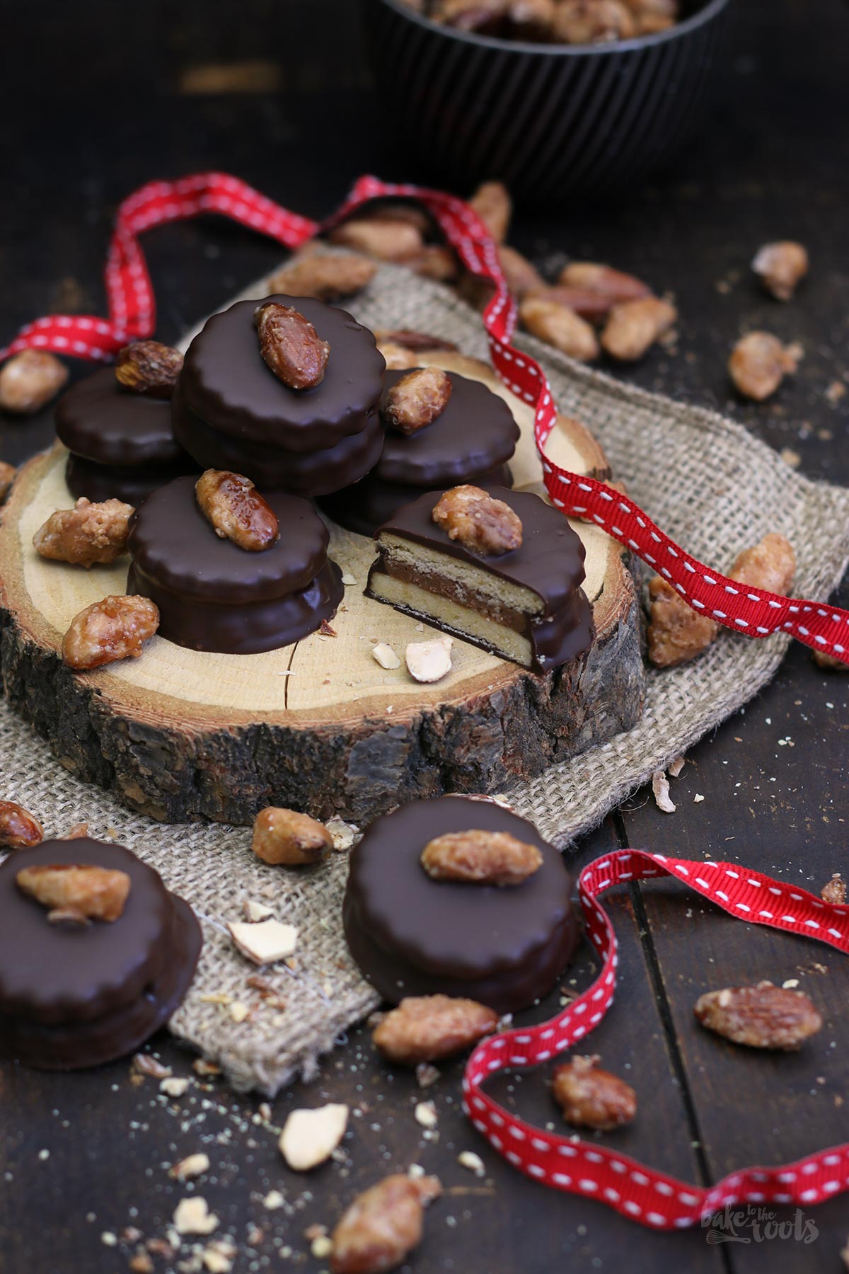 Candied Almonds & Chocolate Nougat Sandwich Cookies | Bake to the roots