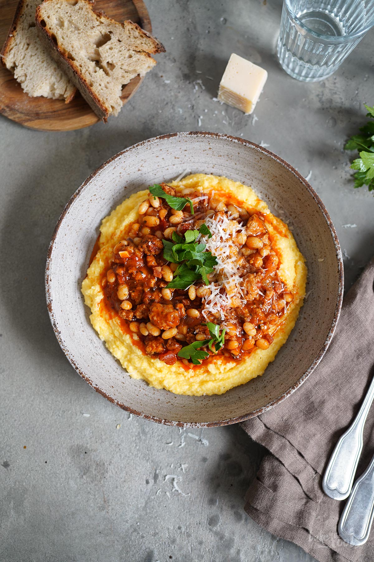 Sausage & Bacon Ragù with White Beans and Polenta | Bake to the roots