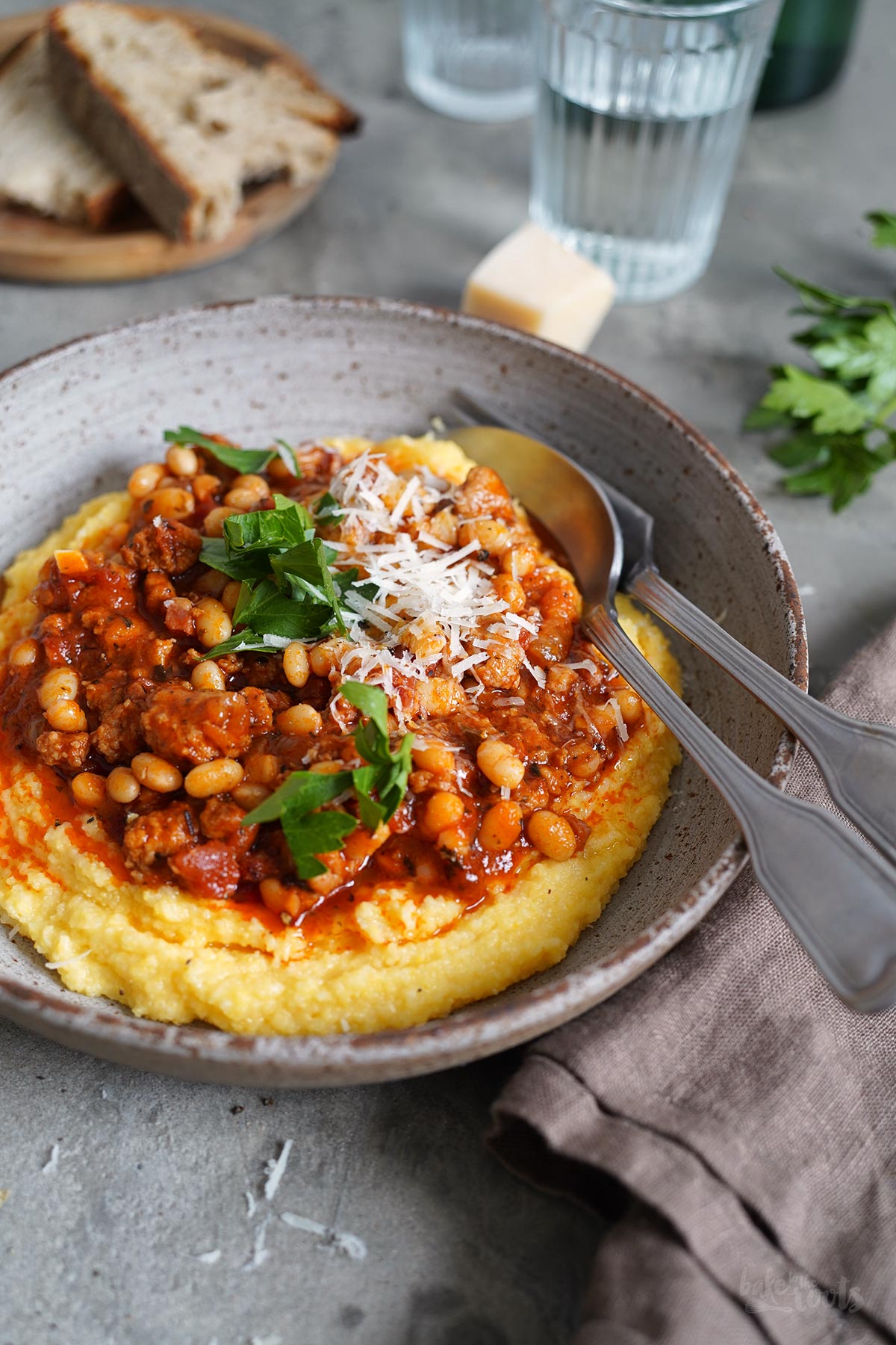 Sausage & Bacon Ragù with White Beans and Polenta | Bake to the roots